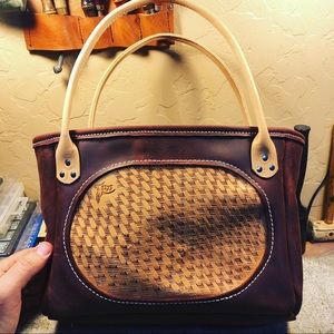 All “real” leather hand made open top bag.